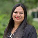 A photo of a Filipino woman with long black hair. She is wearing a black blazer